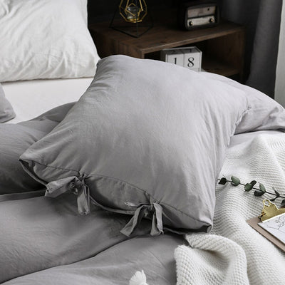 Einfarbiger Bettbezug mit grauen Schleifen