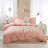 Einfarbiger Bettbezug mit rosa Pompons